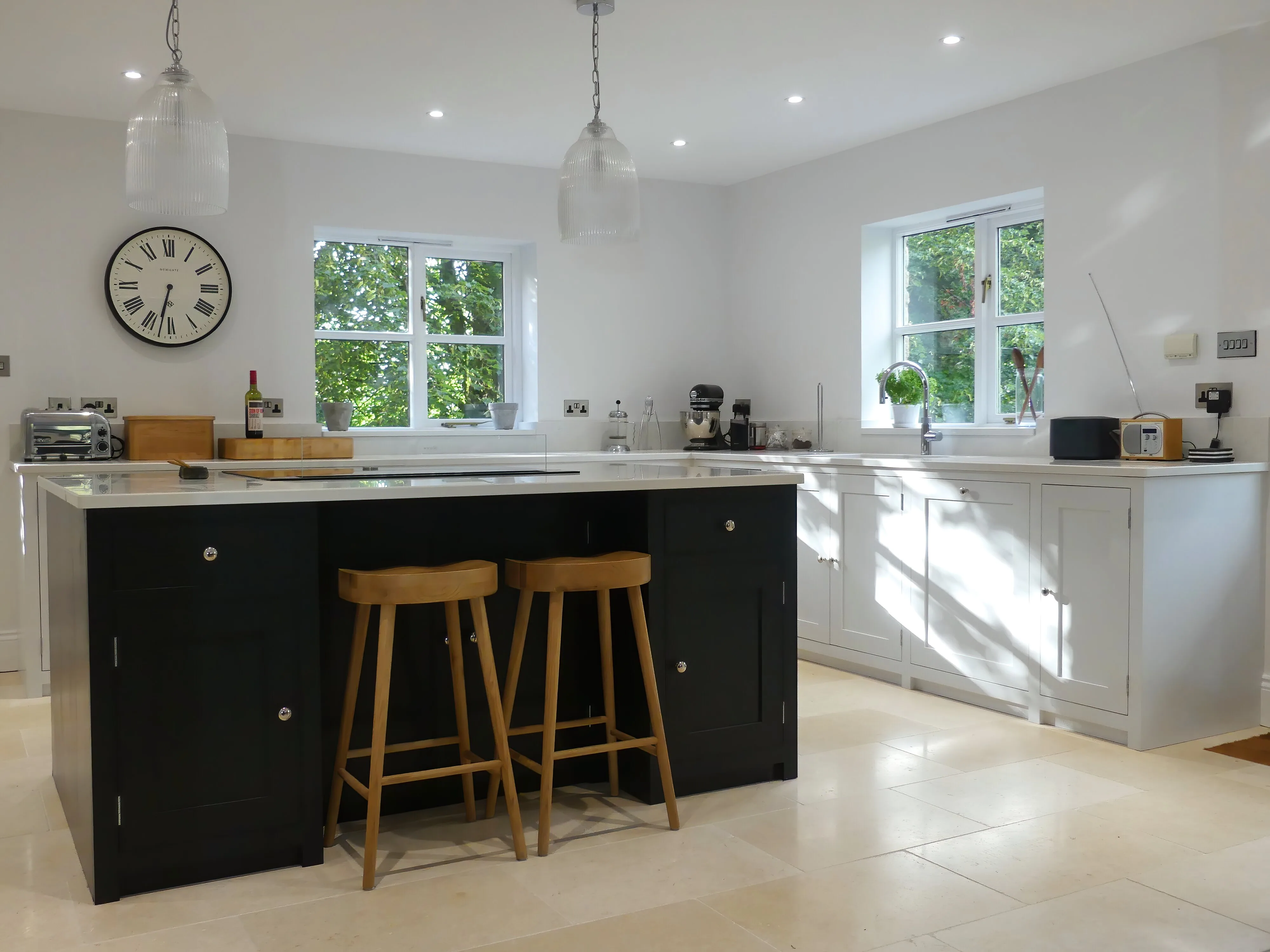 Bespoke shaker kitchen with a navy island and oak stools, handmade in Wickwar