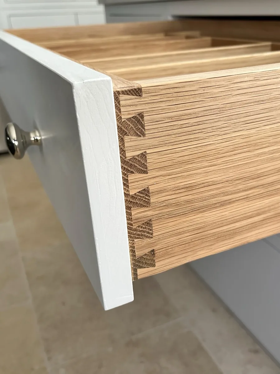 Hand-cut dovetail joint on a solid oak drawer box, made in the Wickwar workshop